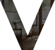 A imagem de uma letra V, com detalhes internos e cores predominante secundárias da imobiliária Lucca